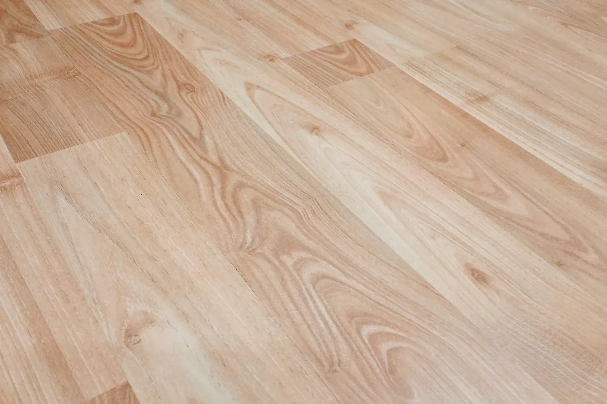 Close view of light wood-look flooring with varied grain patterns
