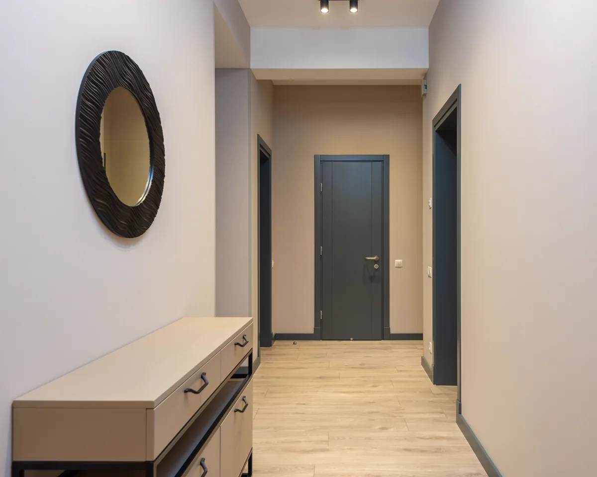 Hallway with light wood-look plank flooring