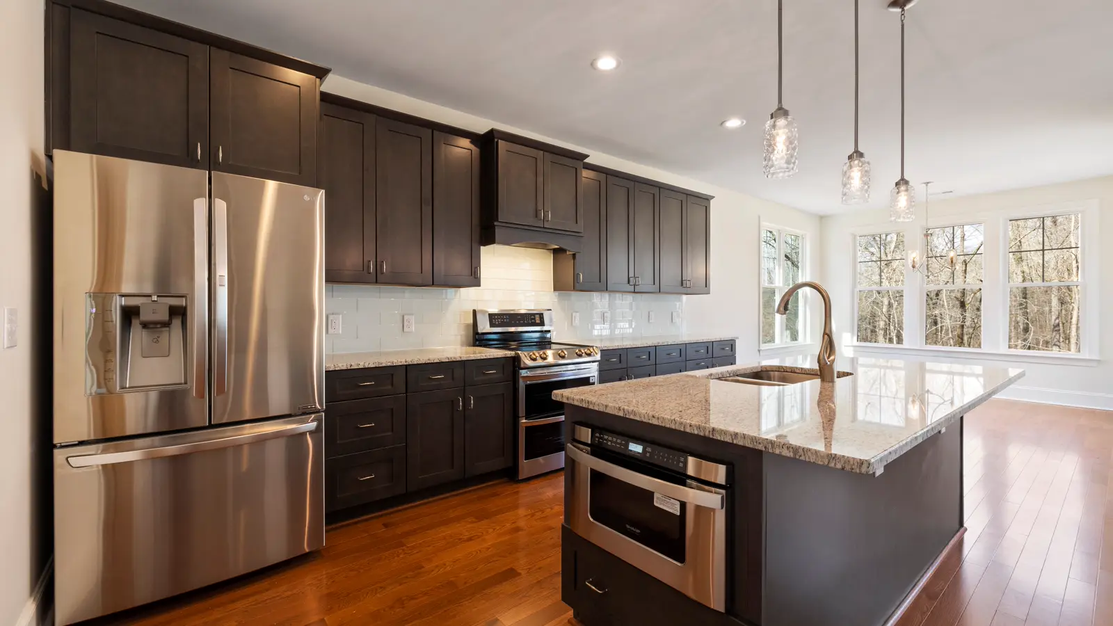 Hardwood Flooring Modern kitchen with a visible brown hard-surface floor