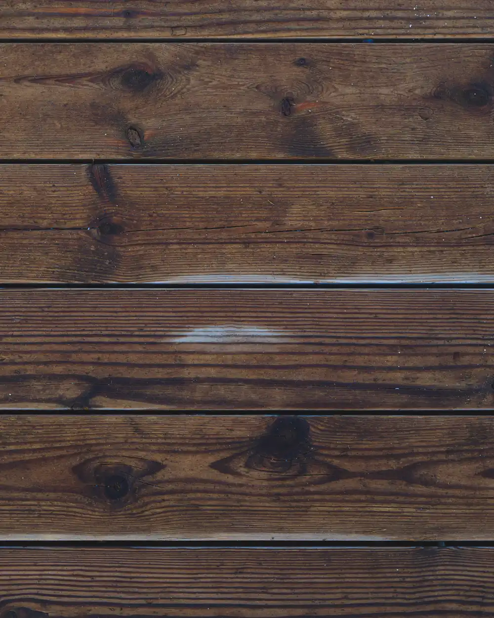 Close view of brown planks with visible joints