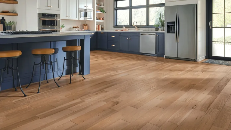 Engineered vs. solid hardwood flooring: what’s the difference? Kitchen with natural solid hardwood flooring