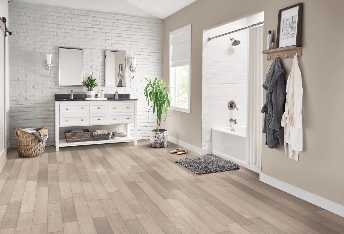 Mudroom with light solid hardwood flooring