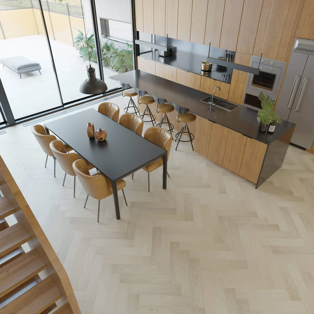 Modern kitchen with light herringbone wood-look flooring