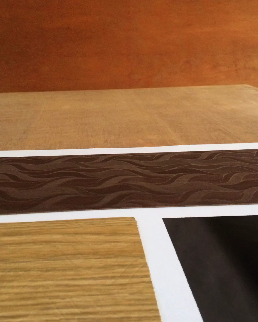 Laminate sample boards showing varied finishes and visible edges